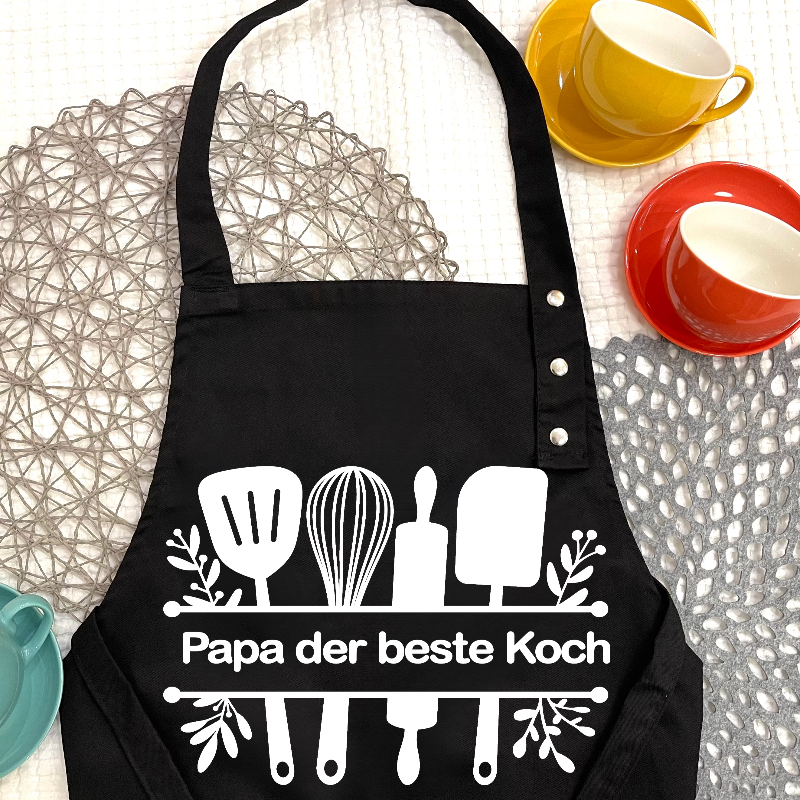 Kochschürze bedrucken mit eigenem name-schürze liegt auf dem Tisch-Koch style